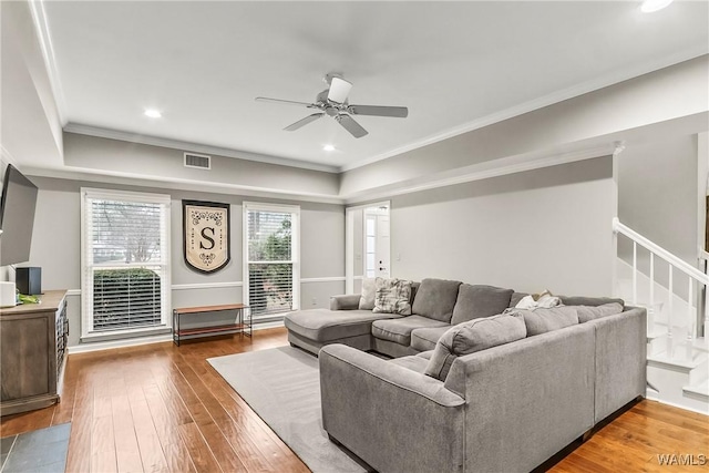 living room with ceiling fan, dark hardwood / wood-style flooring, and crown molding