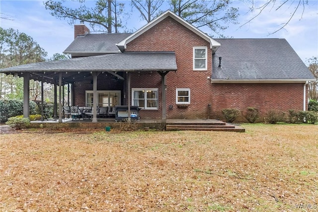 rear view of house with a lawn, a patio area, and ceiling fan