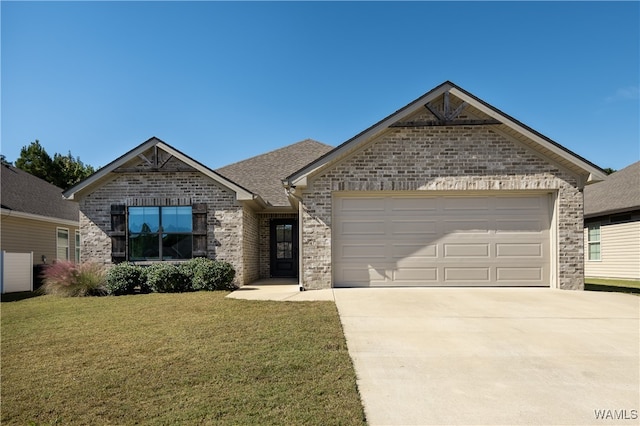 view of front of property featuring a front lawn and a garage