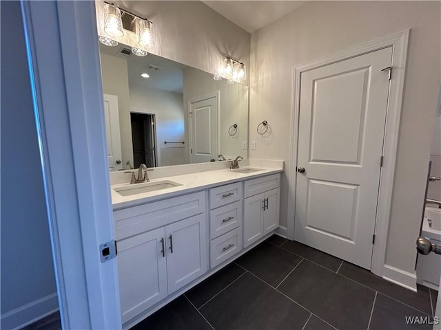 13761 Blackoak Dr, Northport, AL 35475 - full bathroom featuring tile patterned flooring, double vanity, and baseboards