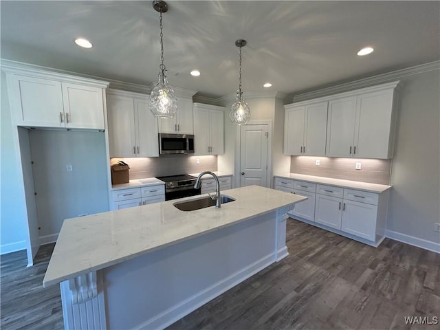 13761 Blackoak Dr, Northport, AL 35475 - kitchen featuring appliances with stainless steel finishes, a sink, white cabinets, tasteful backsplash, and recessed lighting