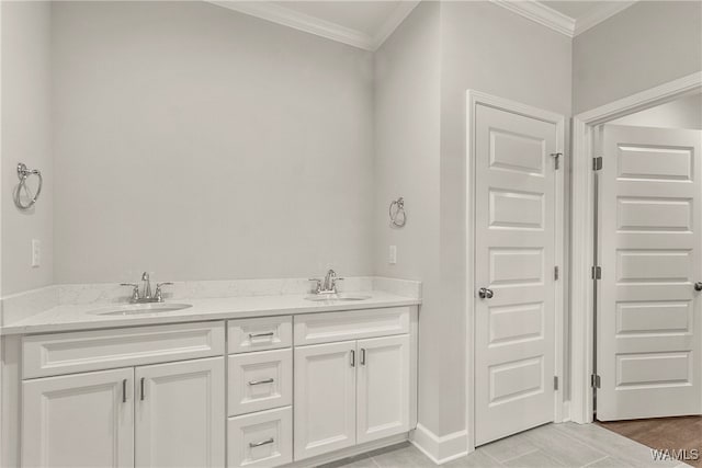 bathroom featuring hardwood / wood-style flooring, vanity, and crown molding