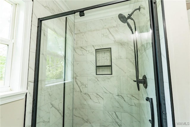 full bathroom with a marble finish shower