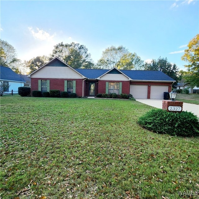 single story home featuring a garage and a front yard