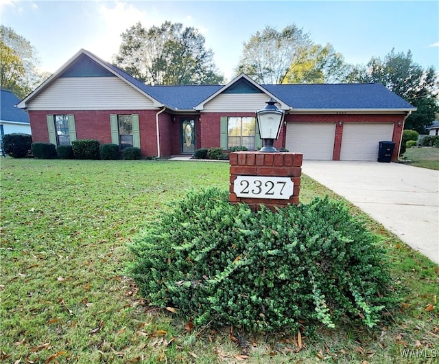 single story home featuring a garage and a front yard