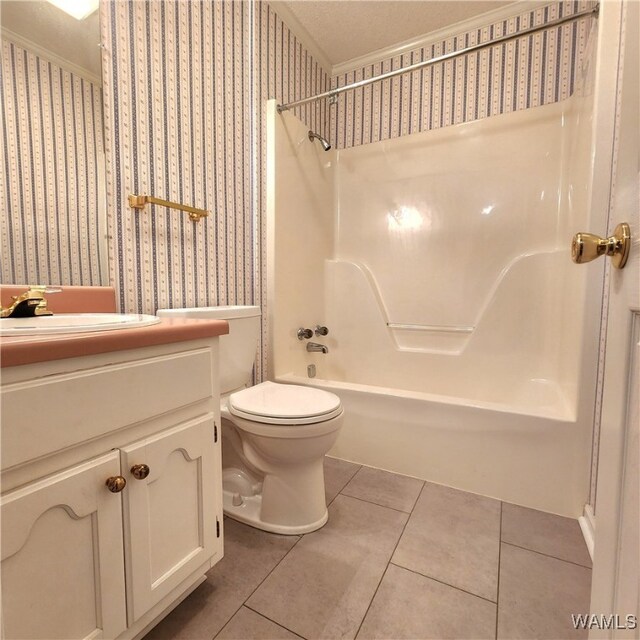 full bathroom featuring vanity, tile patterned flooring, toilet, a textured ceiling, and shower / bathtub combination