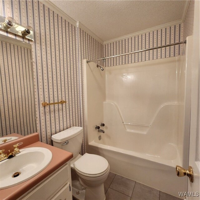 full bathroom with shower / bathtub combination, vanity, a textured ceiling, tile patterned flooring, and toilet