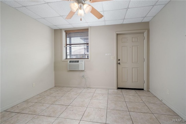 1212 12th St Unit 35, Tuscaloosa, AL 35401 - empty room featuring a paneled ceiling, baseboards, ceiling fan, and light tile patterned floors