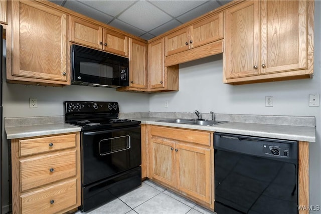 1212 12th St Unit 35, Tuscaloosa, AL 35401 - kitchen with black appliances, light tile patterned floors, a sink, and light countertops