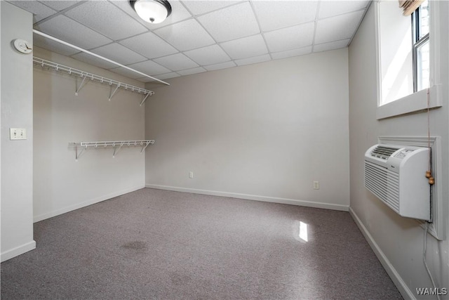 1212 12th St Unit 35, Tuscaloosa, AL 35401 - interior space featuring baseboards, carpet flooring, a drop ceiling, and a wall unit AC