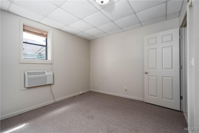 1212 12th St Unit 35, Tuscaloosa, AL 35401 - unfurnished room with baseboards, a paneled ceiling, carpet flooring, and a wall mounted AC