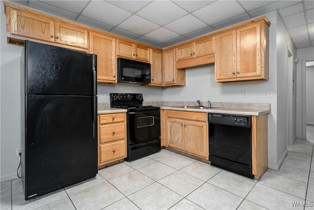 1212 12th St Unit 35, Tuscaloosa, AL 35401 - kitchen with black appliances, a sink, a paneled ceiling, and light countertops