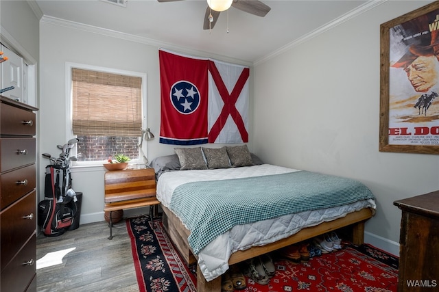 bedroom with ceiling fan, ornamental molding, and light wood-type flooring