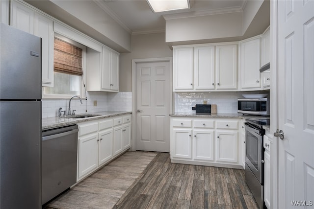 kitchen featuring white cabinets, stainless steel appliances, dark wood-type flooring, and sink