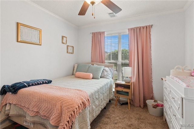 bedroom with crown molding, ceiling fan, carpet flooring, and visible vents