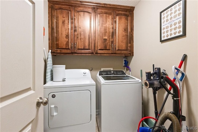 laundry area with cabinet space and washer and dryer