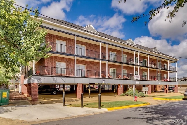 712 Frank Thomas Ave Unit 303, Tuscaloosa, AL 35401 - view of property with covered parking