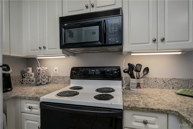 712 Frank Thomas Ave Unit 303, Tuscaloosa, AL 35401 - kitchen with range with electric cooktop, black microwave, white cabinets, and light countertops