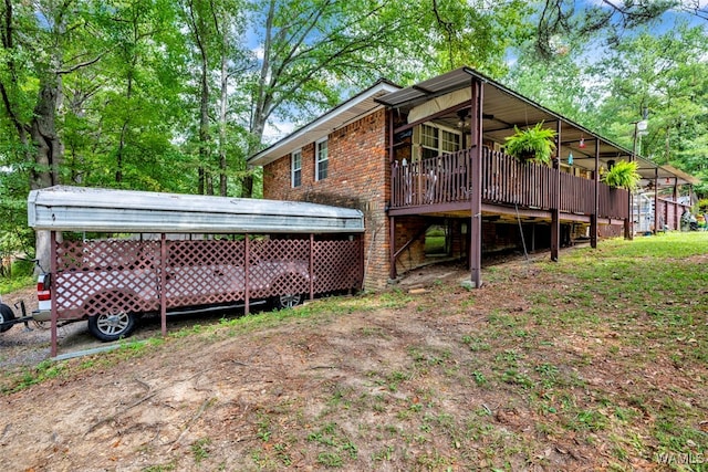 back of house featuring a wooden deck