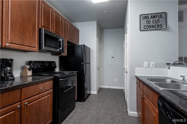 600 13th St E Unit 532, Tuscaloosa, AL 35401 - kitchen with black appliances, a sink, dark tile patterned flooring, baseboards, and dark stone counters