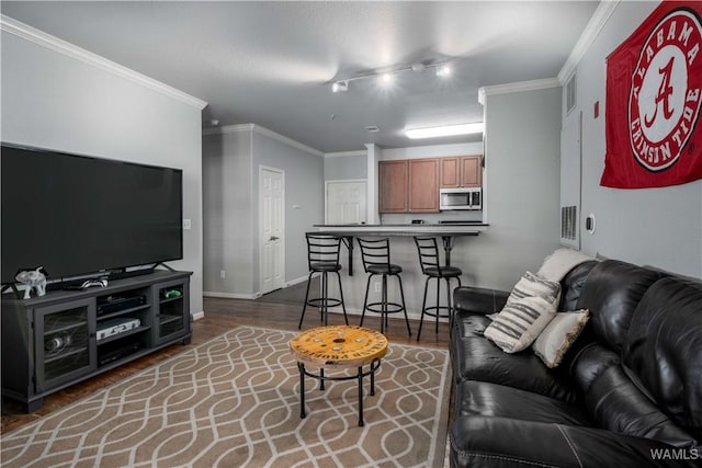 600 13th St E Unit 532, Tuscaloosa, AL 35401 - living room featuring ornamental molding, wood finished floors, baseboards, and track lighting