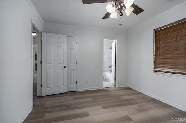 4205 Cloverdale Est, Northport, AL 35473 - unfurnished bedroom featuring wood finished floors, crown molding, baseboards, and ensuite bathroom