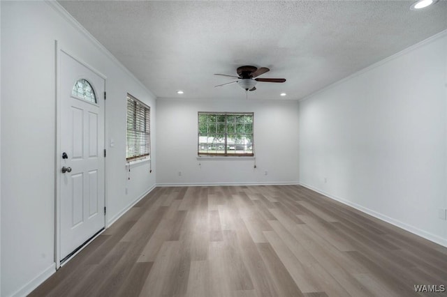 4205 Cloverdale Est, Northport, AL 35473 - foyer with ceiling fan, crown molding, wood finished floors, a textured ceiling, and recessed lighting