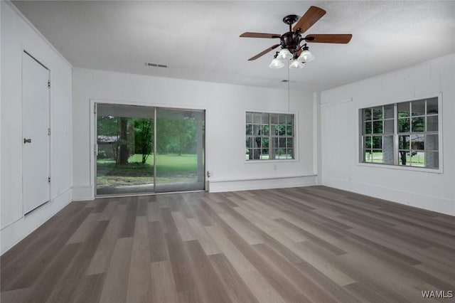 4205 Cloverdale Est, Northport, AL 35473 - unfurnished room featuring wood finished floors, a ceiling fan, and healthy amount of natural light