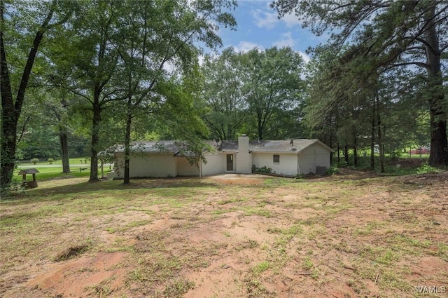 4205 Cloverdale Est, Northport, AL 35473 - view of green lawn with view of scattered trees and a patio area