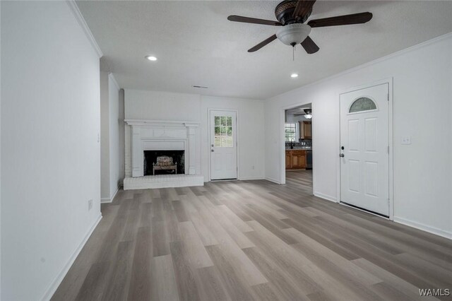 4205 Cloverdale Est, Northport, AL 35473 - unfurnished living room with a ceiling fan, wood finished floors, baseboards, crown molding, and recessed lighting
