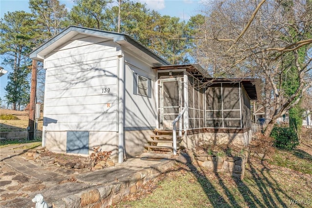 exterior space featuring a sunroom