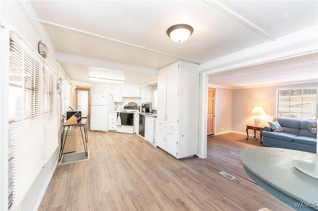 kitchen featuring light hardwood / wood-style flooring, white cabinets, and white appliances