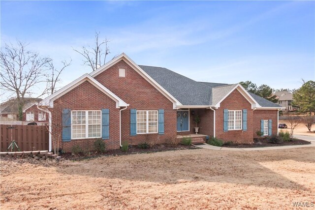 ranch-style home with a front lawn