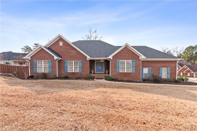 ranch-style house featuring a front lawn