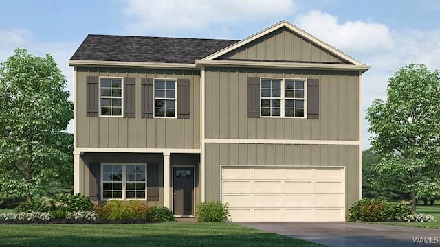 view of front of house featuring a front yard and a garage