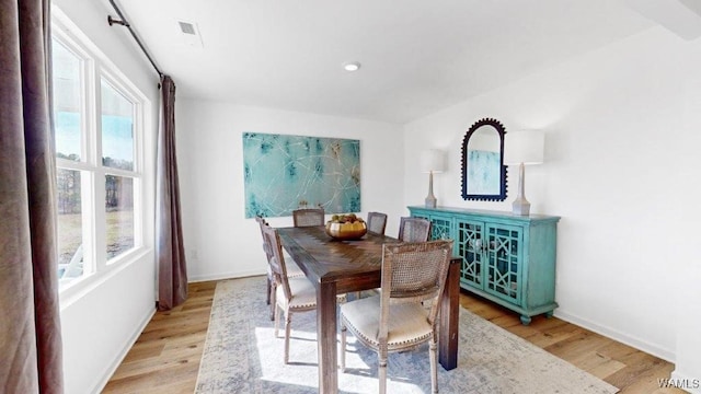 dining area featuring plenty of natural light and light wood-type flooring