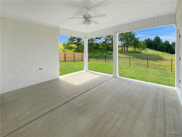 deck featuring ceiling fan and a yard