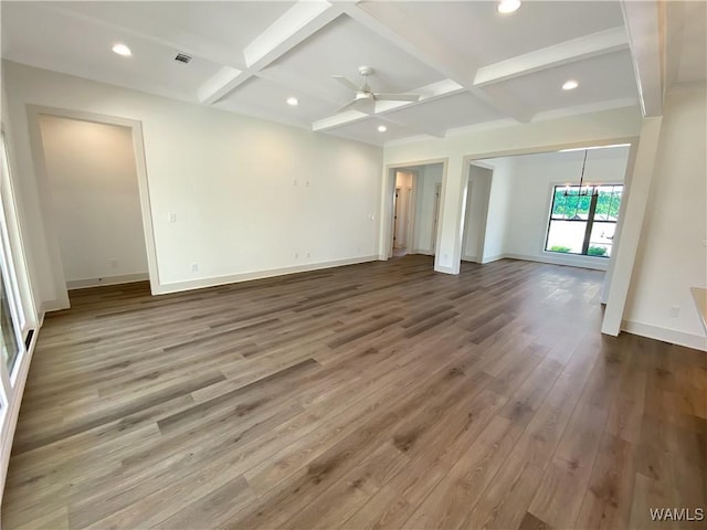 empty room featuring ceiling fan, beamed ceiling, and coffered ceiling