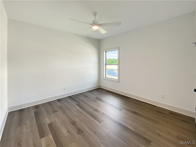 empty room with ceiling fan and hardwood / wood-style flooring