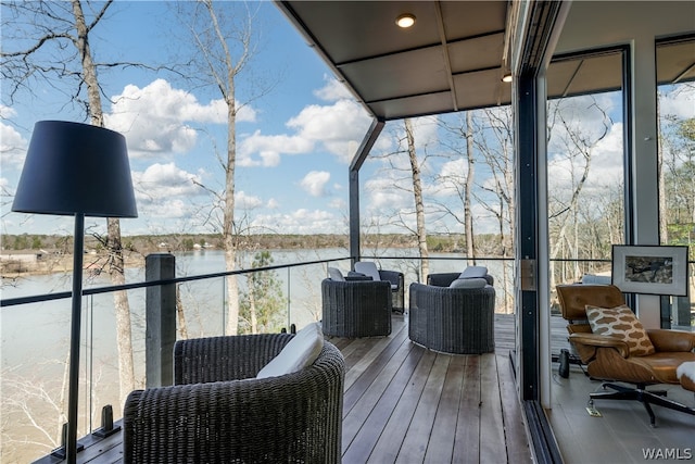 wooden deck featuring a water view