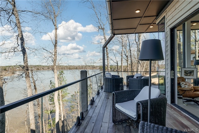 wooden terrace with a water view