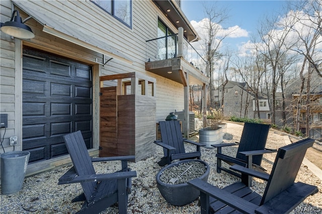 view of patio featuring a balcony