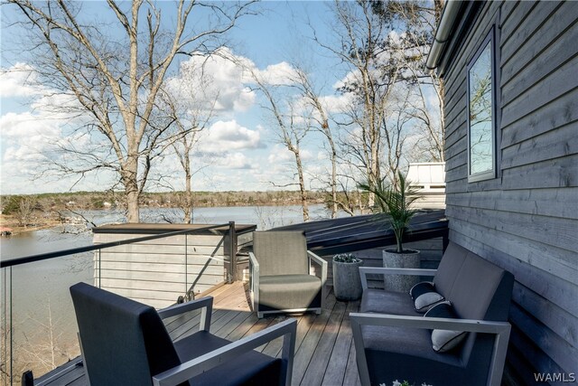 wooden terrace with a water view