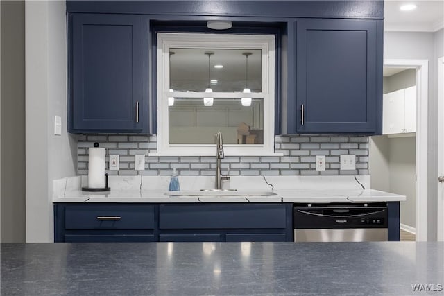 kitchen with a sink, blue cabinets, dishwasher, and tasteful backsplash