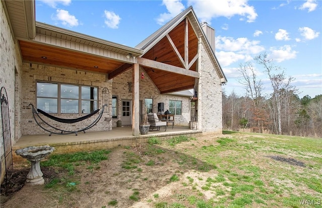 17505 Mormon Rd, Northport, AL 35475 - rear view of house featuring a patio and a chimney
