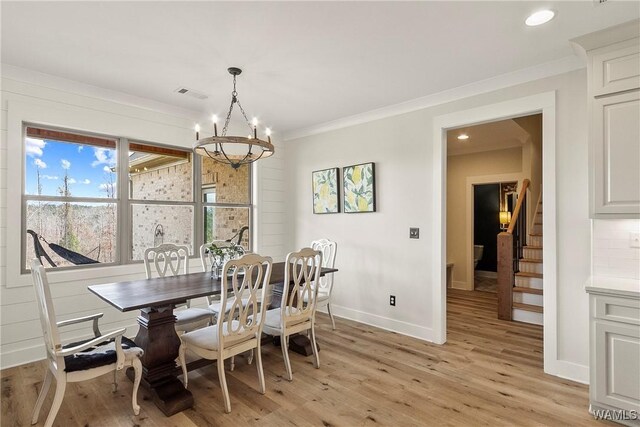 17505 Mormon Rd, Northport, AL 35475 - dining area featuring a chandelier, stairway, light wood-type flooring, recessed lighting, and crown molding