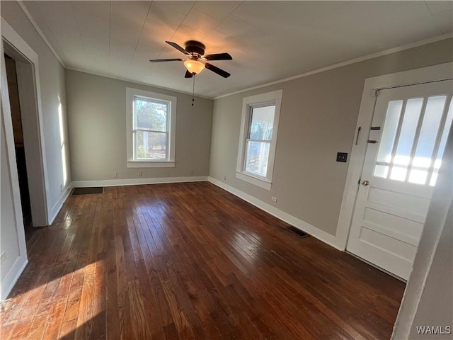 entrance foyer with baseboards, visible vents, a ceiling fan, ornamental molding, and dark wood-style flooring