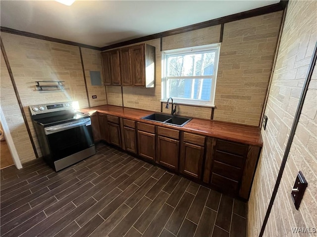 kitchen featuring decorative backsplash, butcher block countertops, wood tiled floor, stainless steel electric stove, and a sink