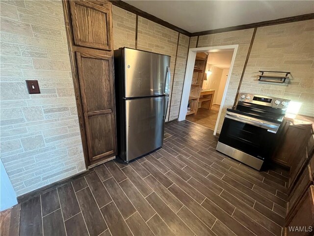 kitchen with light countertops, appliances with stainless steel finishes, and wood finish floors