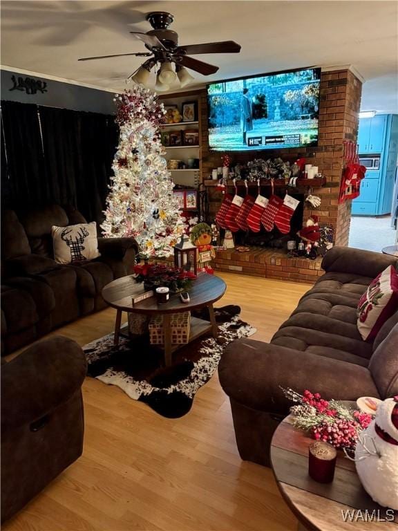 living room featuring hardwood / wood-style flooring and ceiling fan